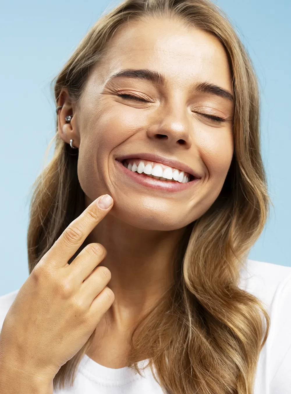 Patient smiling confidently after receiving personalized dental care under CDCP coverage.