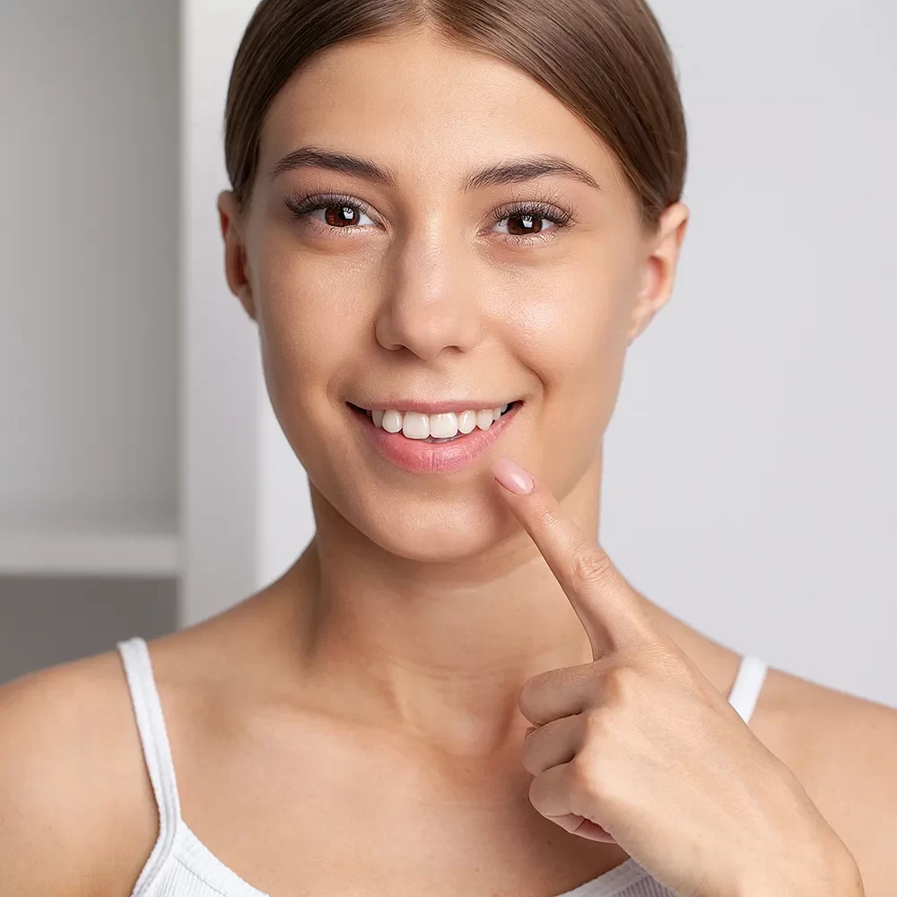 Happy patient in Canada showing off their teeth after Onyx Dental treatment.